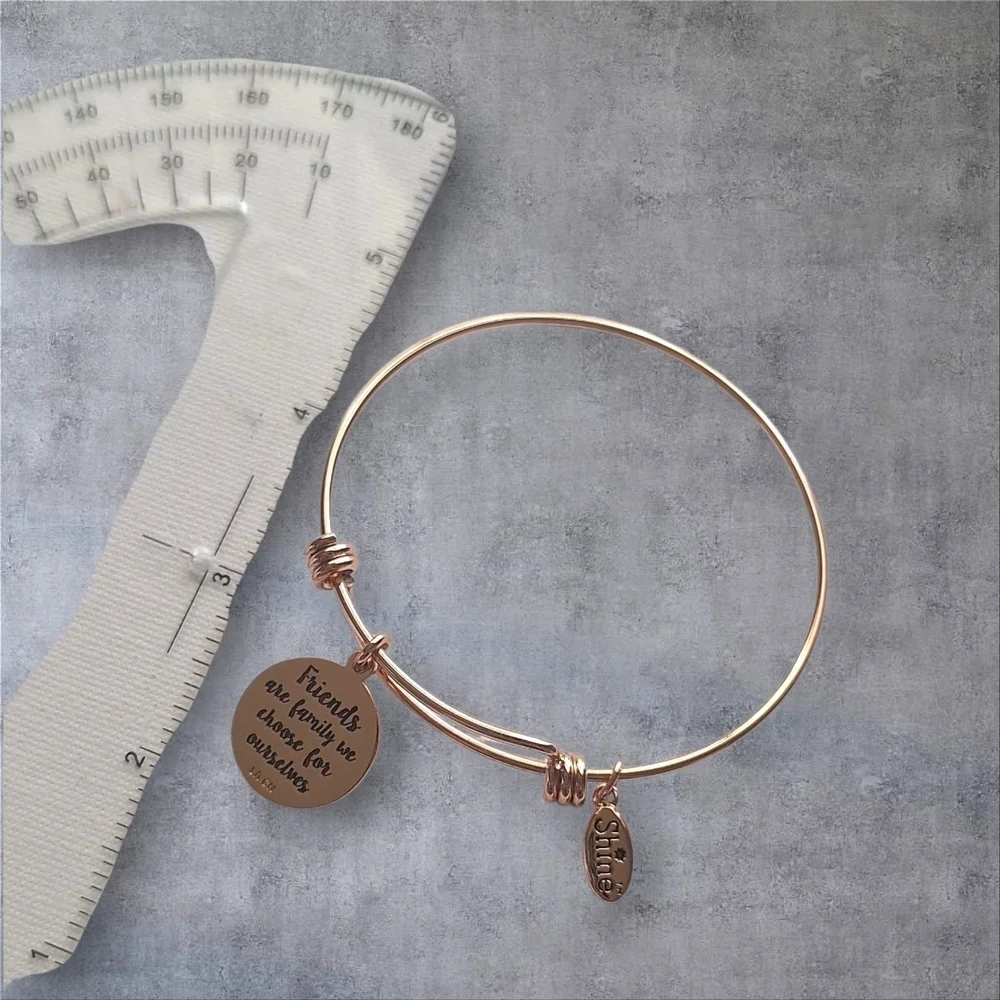 Unwritten Rose Gold Bangle Bracelet with Charms